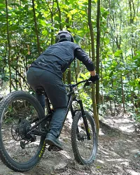 Guy easily riding on trail