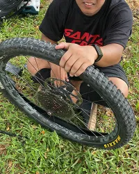 guy repairing flat mtb tire