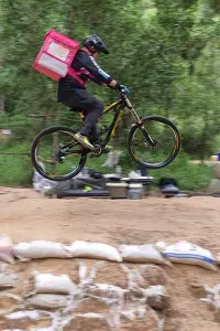 Food delivery doing jumps on mtb