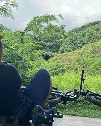 guy on mtb looking over the hill side