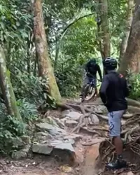 Guy in mountain bike thinking his alternative trail