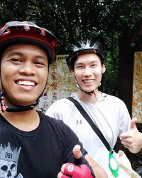 2 guys smiling on the trail